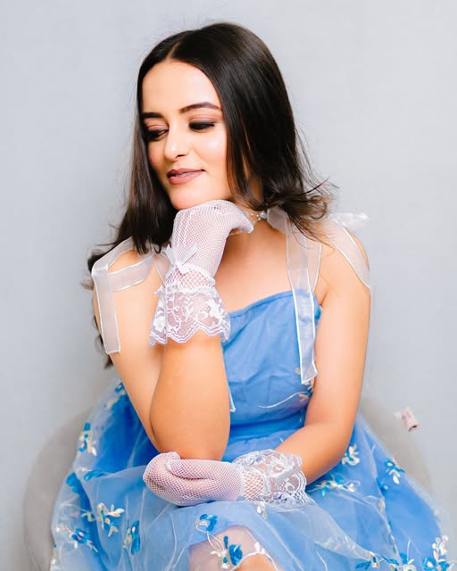 Elegant portrait of a woman in a blue dress